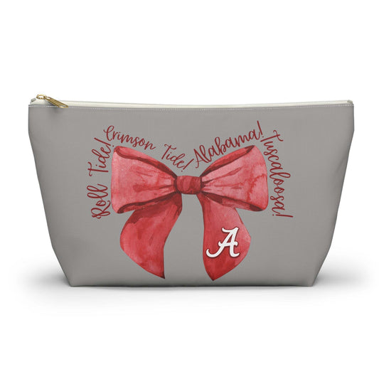 Crimson Bow Alabama script accessory pouch with vibrant red bow and gold zipper puller