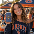 Aubie Mascot Can Cooler in navy blue with vintage Auburn tiger mascot design held by a smiling woman wearing Auburn Tigers apparel
