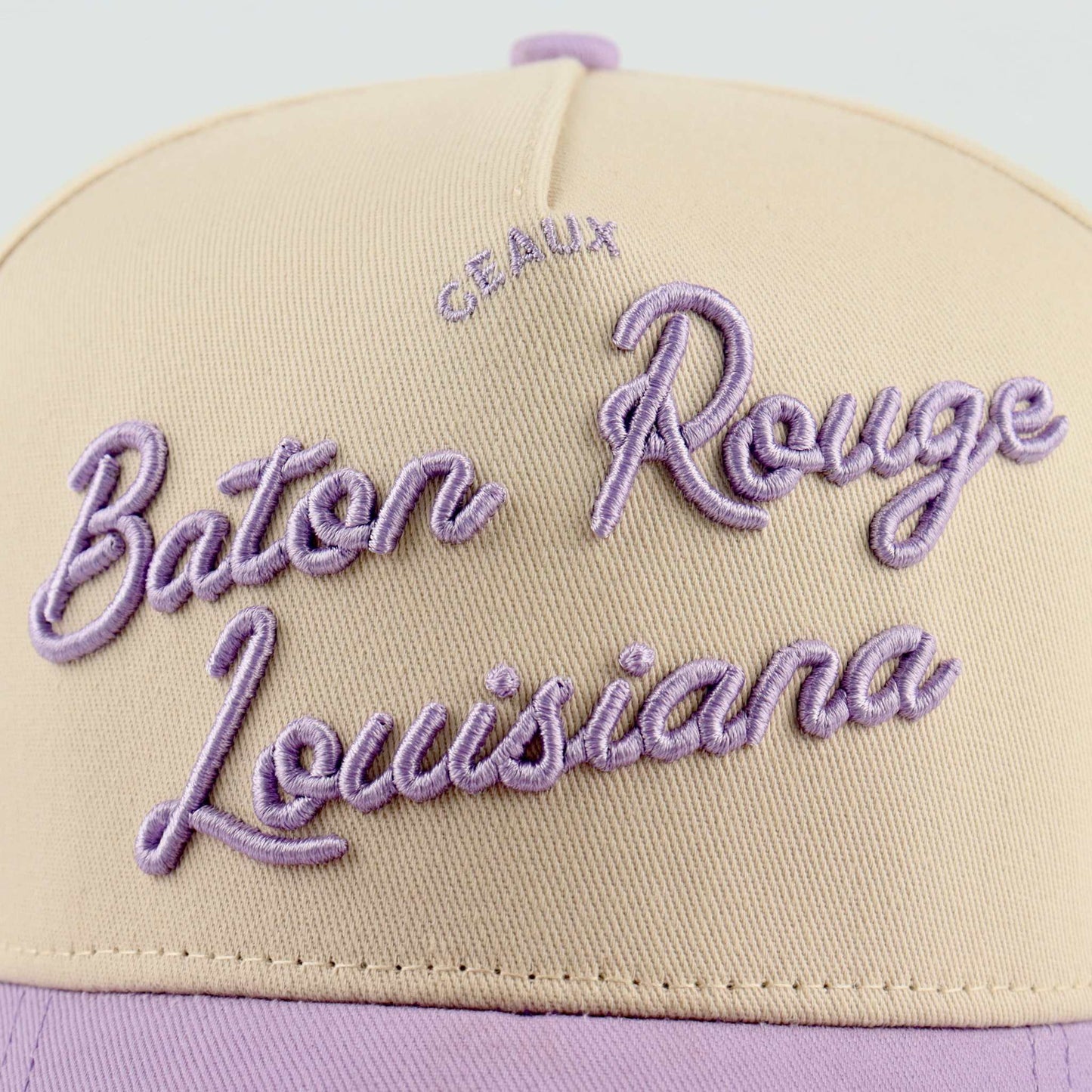 Trucker hat in beige and lavender with raised Baton Rouge Louisiana script, Callin’ Baton Rouge! design