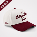 College Station Script Hat in cream and maroon cotton, featuring embroidered script lettering and a pre-curved brim