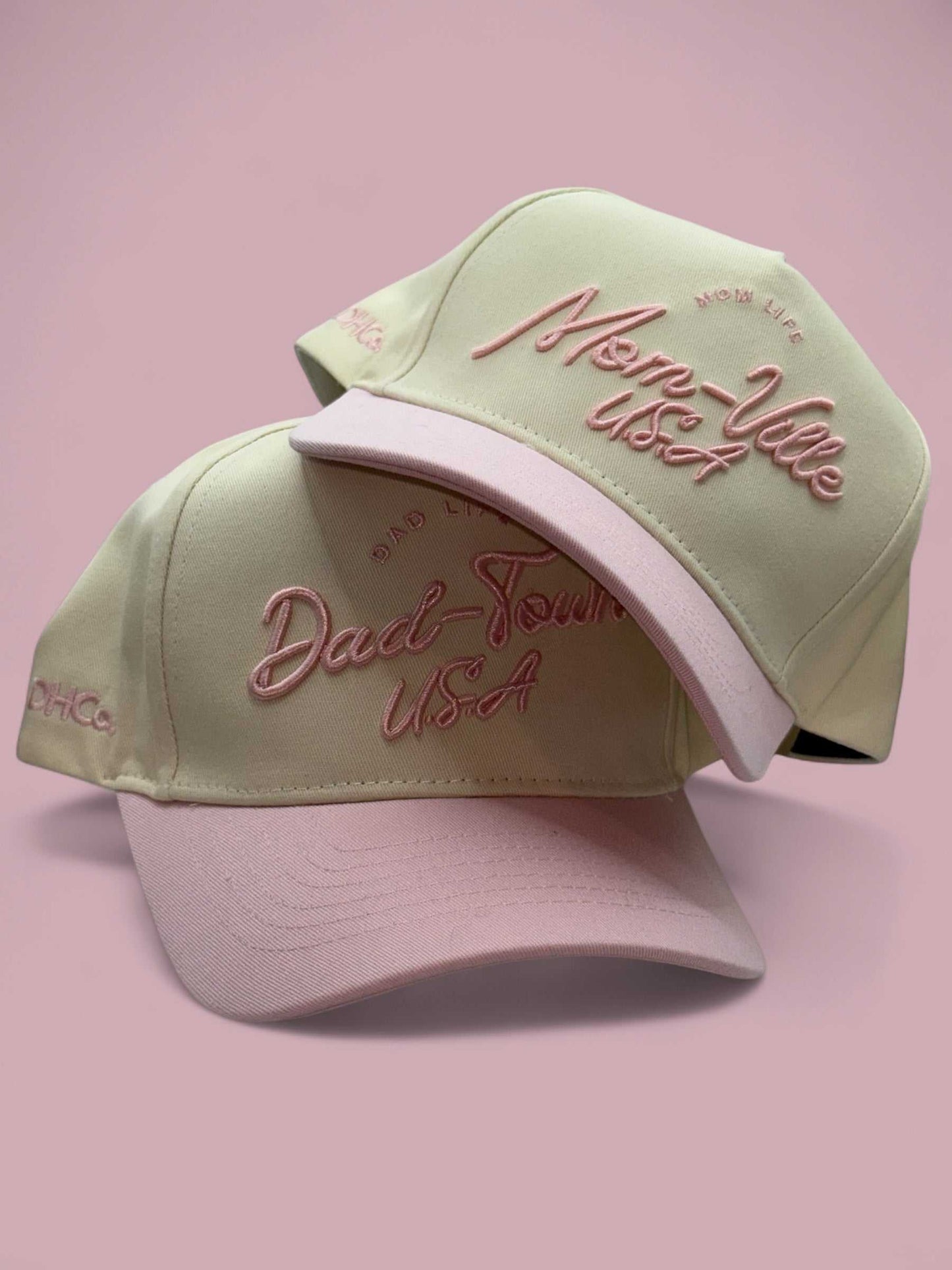 Dad-Town Script Hat in beige and light pink with embroidered script, pre-curved brim, and trucker mesh