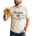 Ellas Fellas Club Western T-shirt in white cotton with vintage-style blue and gold graphic text and crest design.