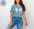Ice Blue Comfort Colors® short sleeve tee with blue and orange game-day bow design