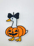 Pumpkin Goose Freshie featuring an orange glitter pumpkin-bodied goose with a black bow and jack-o'-lantern face