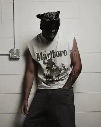 Rugged Man Cut Off Tee in vintage white cotton, featuring a distressed Marlboro cowboy graphic and raw armholes