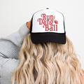 Run The Dang Ball trucker hat in black and white with red football graphic and adjustable mesh back