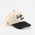 The Dallas Script Hat, beige and black pre-curved trucker cap with embroidered Dallas script and black brim