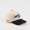The Lafayette Script Hat, beige cotton cap with black embroidered script, black pre-curved brim and low-profile fit