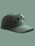 The Texas Performance Snapback, olive green nylon cap with perforated panels and raised tonal lettering