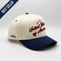 U.S.A Script Hat in cream and navy cotton, featuring red embroidered “United States of America” script and curved brim