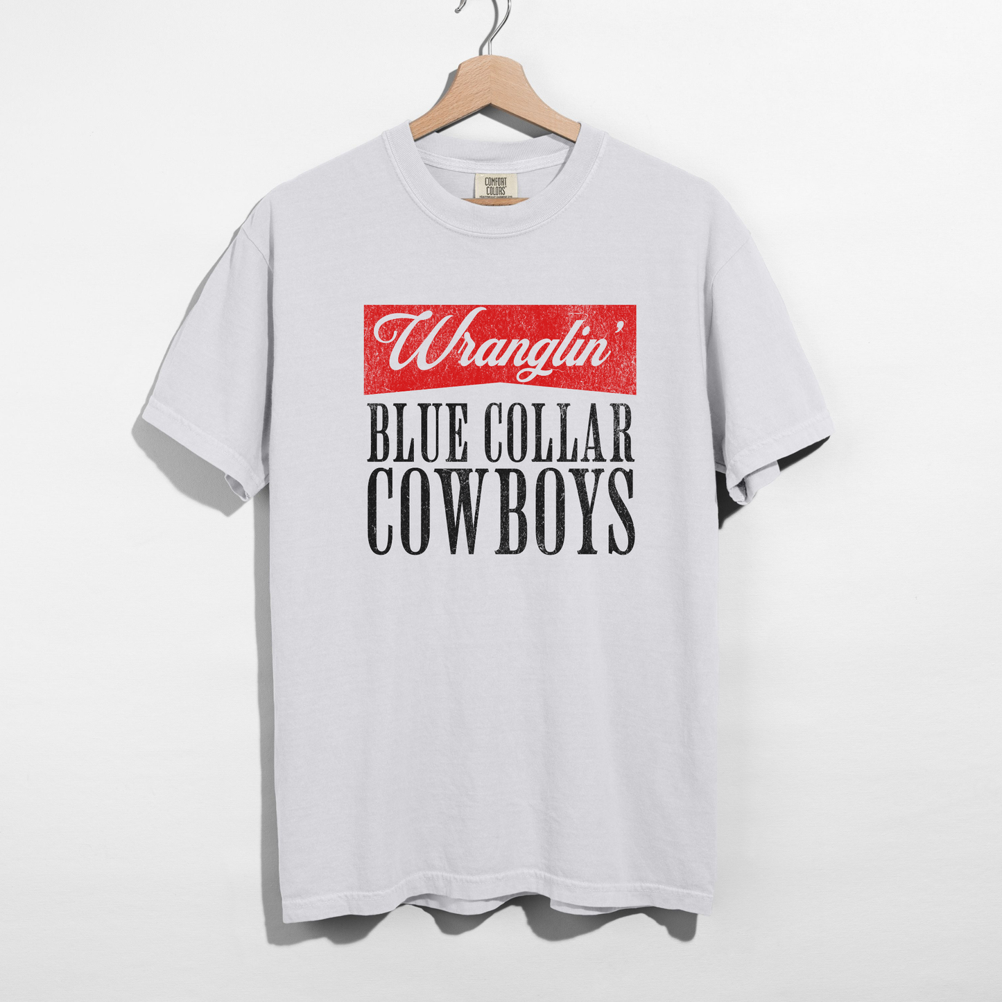 White cotton Wranglin’ Blue Collar Cowboys Graphic Tee with a vintage red and black distressed western print on the front