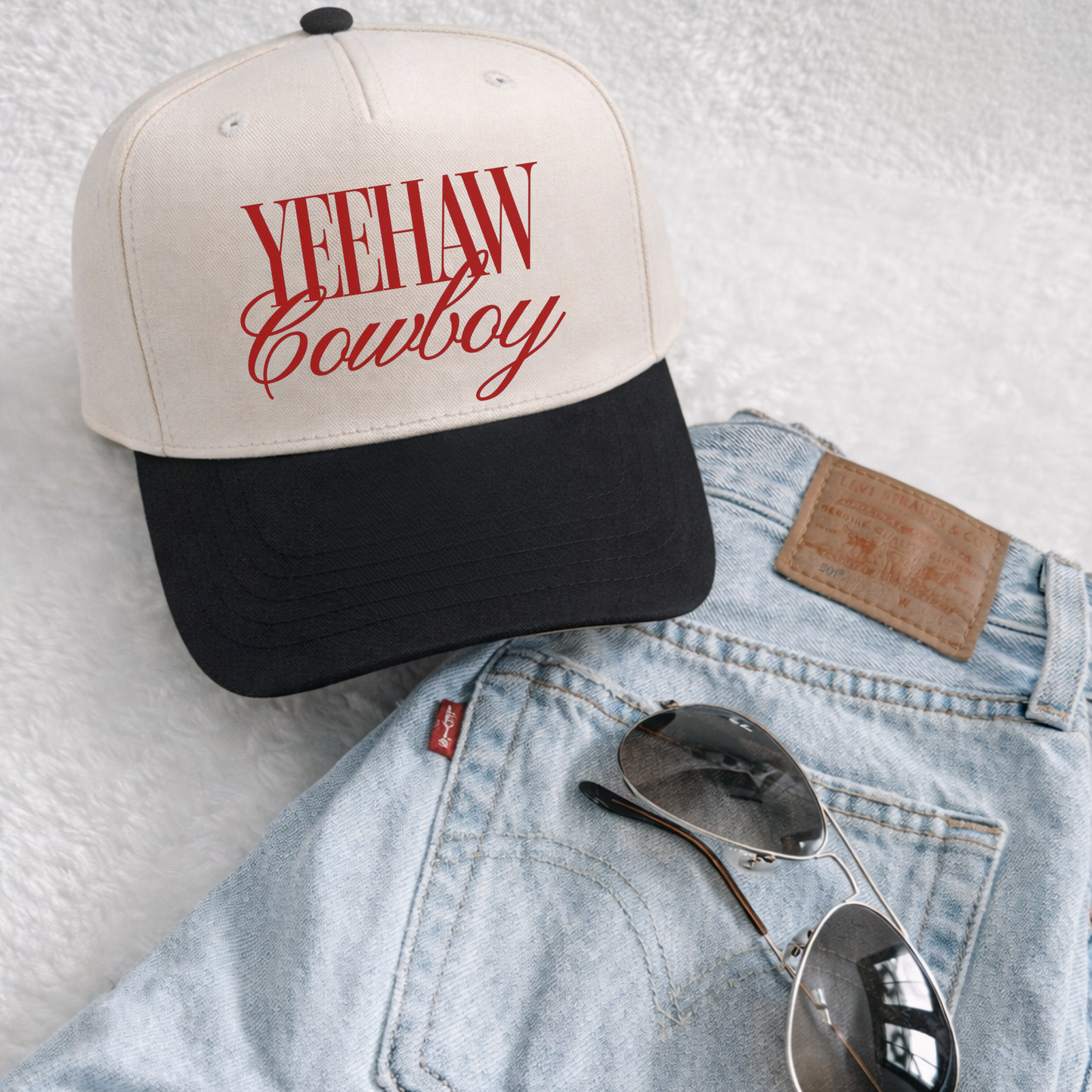 Yeehaw Cowboy Trucker Hat in cream and black with bold red western cowboy lettering and structured curved brim