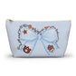 Light blue T-bottom cosmetic pouch with blue bow Auburn logo and collegiate icons, gold zipper pull, wrinkle-resistant polyester