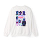 An white crewneck sweatshirt shown from the back, featuring a colorful graphic print of horror movie villains with text and spooky illustrations.