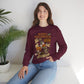 Woman wearing a maroon sweatshirt with text sitting on a white surface with a plant in the background