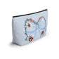 Light-blue T-bottom accessory pouch with watercolor blue bow, Auburn logo, and collegiate icons, gold zipper pull, wrinkle-resistant polyester