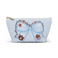Light-blue accessory pouch with blue bow Auburn logo and collegiate icons on front, gold zipper pull, T-bottom cosmetic bag design