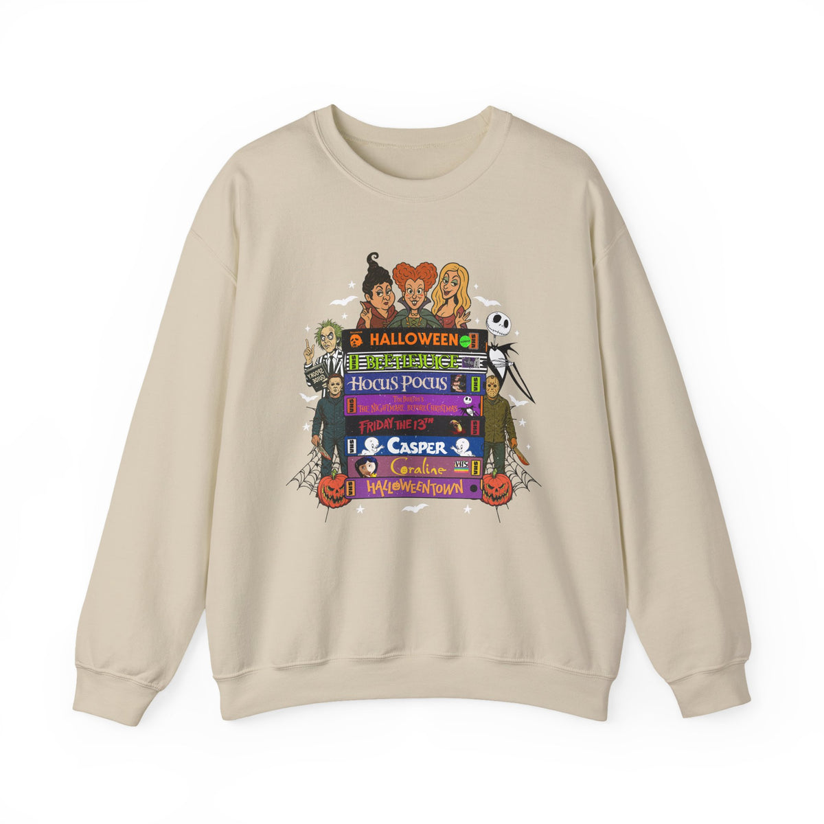 A beige crewneck sweatshirt featuring a colorful graphic print on VHS tapes with Halloween-themed characters and text including 'Halloween', 'Hocus Pocus', 'Casper', and 'Trick or Treat'.