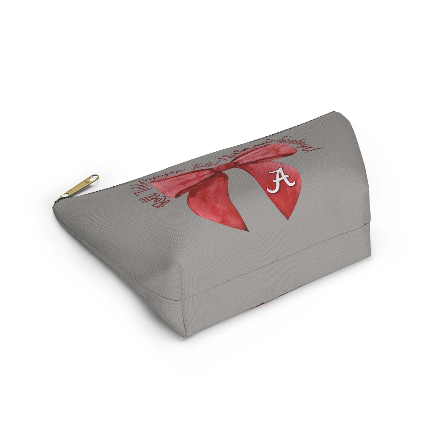 Crimson Bow Alabama script accessory pouch with vibrant red bow and gold zipper puller standing upright