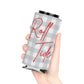 Gray plaid Roll Tide can cooler with red script lettering and foam liner