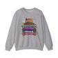A heather gray crewneck sweatshirt featuring a colorful graphic print of various Halloween characters and text including 'Halloween', 'Hocus Pocus', 'Casper', and 'Trick or Treat'.