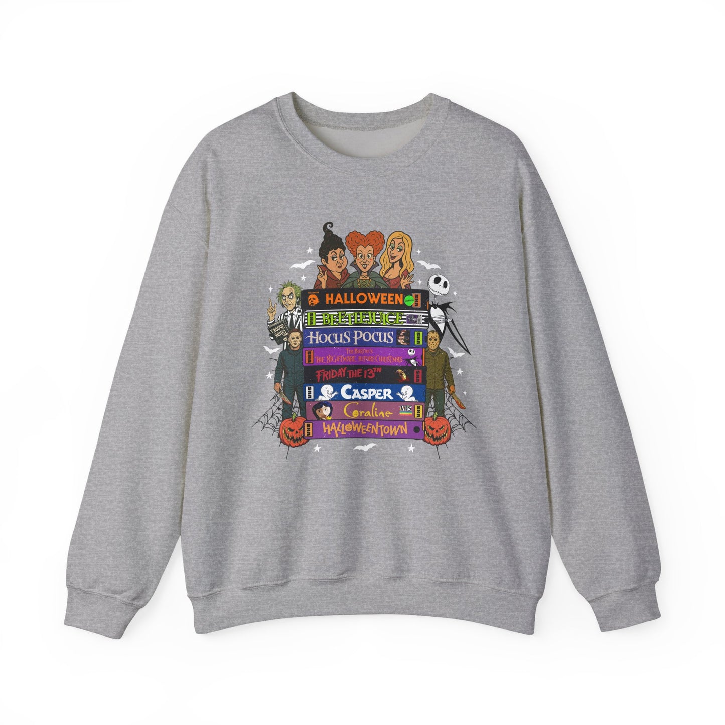 A heather gray crewneck sweatshirt featuring a colorful graphic print of various Halloween characters and text including 'Halloween', 'Hocus Pocus', 'Casper', and 'Trick or Treat'.