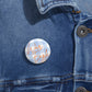 Glossy War Eagle Pin Button with blue gingham script and steel safety-pin back