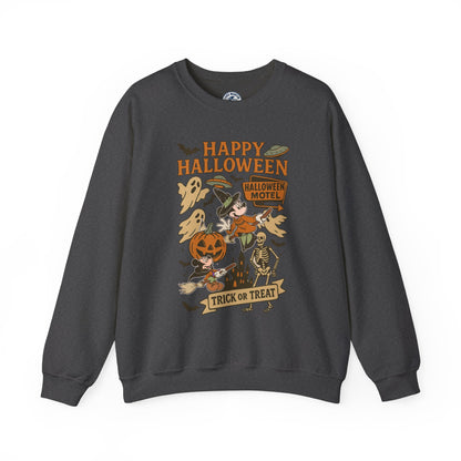 A dark gray crewneck sweatshirt featuring a colorful Halloween-themed graphic print on the front with the text 'HAPPY HALLOWEEN' and illustrations of a witch, skeleton, ghost, and jack-o'-lantern.