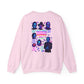 A light pink crewneck sweatshirt shown from the back, featuring a colorful graphic print of serial killer portraits and the text 'KILLERS KILLING GONNA KILL' surrounded by spooky illustrations.