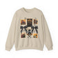 beige crewneck sweatshirt featuring a vintage witch-themed Halloween collage with black bows, bats, pumpkins, and orange accents.

