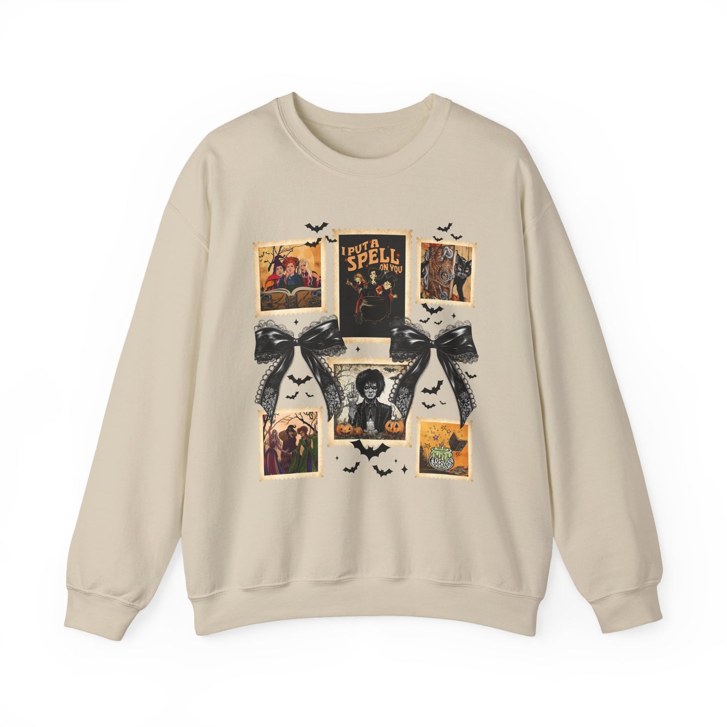 beige crewneck sweatshirt featuring a vintage witch-themed Halloween collage with black bows, bats, pumpkins, and orange accents.
