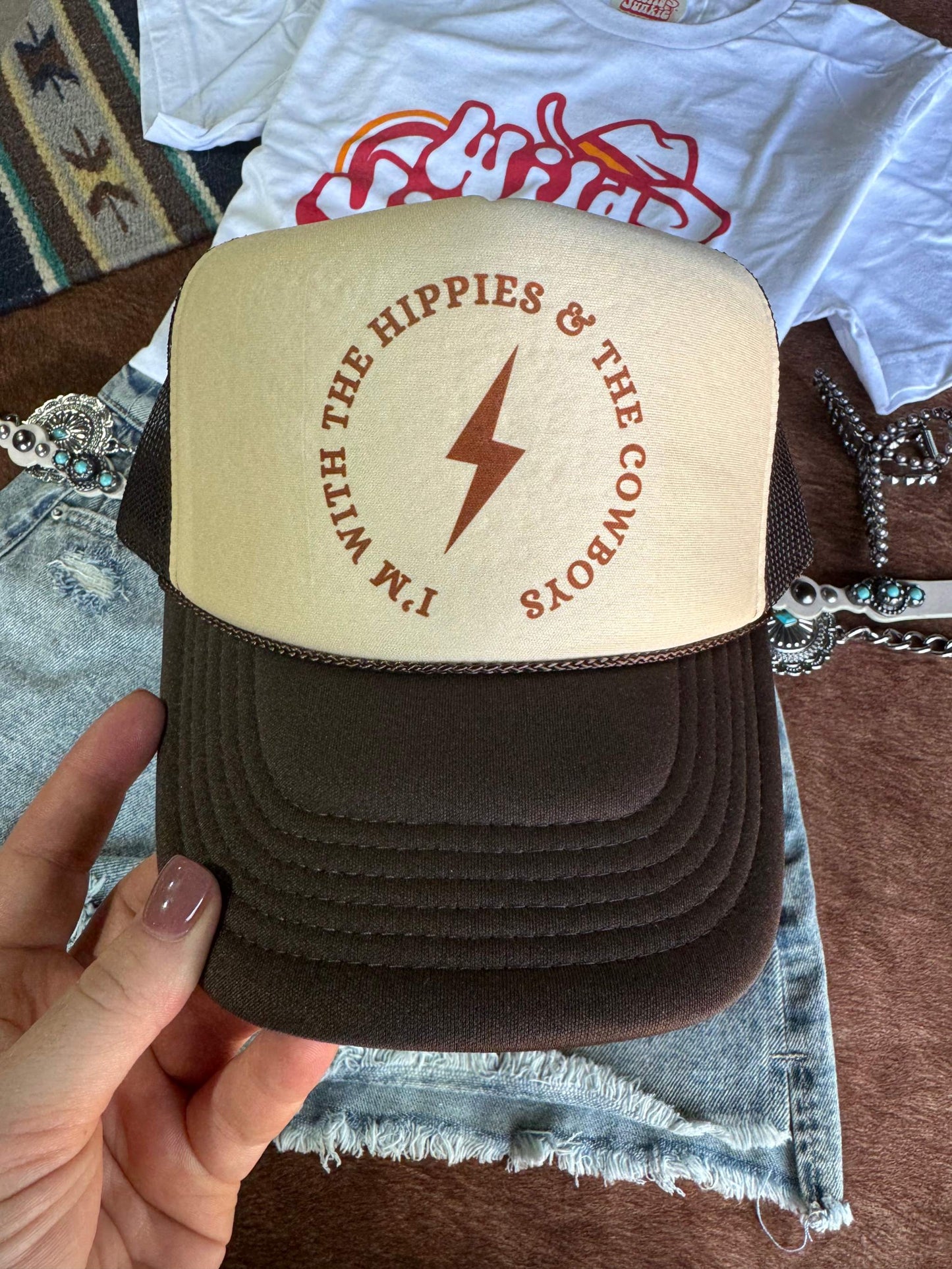 Hippies & Cowboys Trucker Hat with breathable mesh back and adjustable snap closure made of 100% polyester