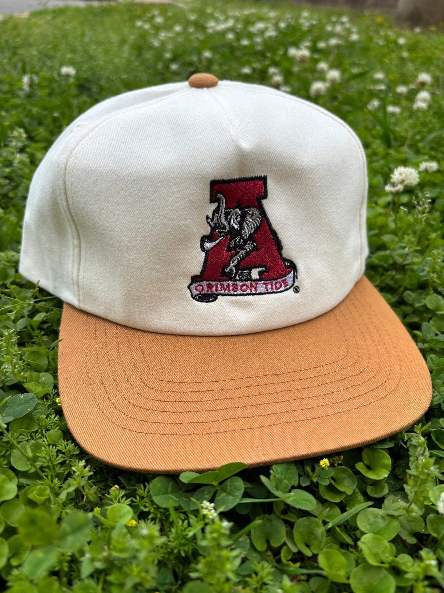 Alabama Crimson Tide cotton snapback hat in cream and tan with embroidered elephant logo and curved brim