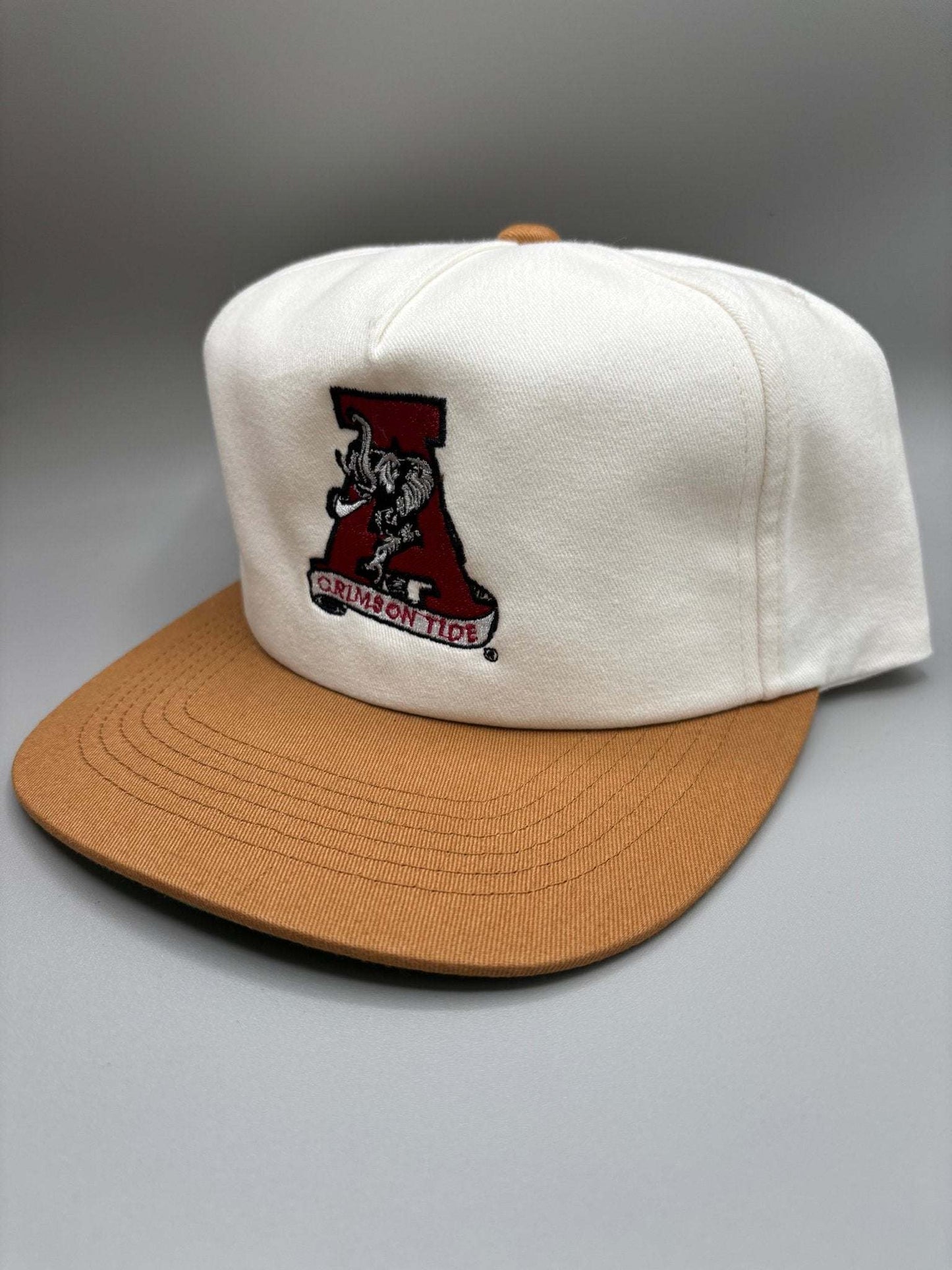 Alabama Crimson Tide snapback hat in white cotton with a tan brim and embroidered Crimson Tide mascot patch