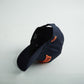 Navy blue cotton snapback hat with bold orange 3D “AUBURN” embroidery and side Alabama State silhouette, part of Auburn Alabama Legacy collection.