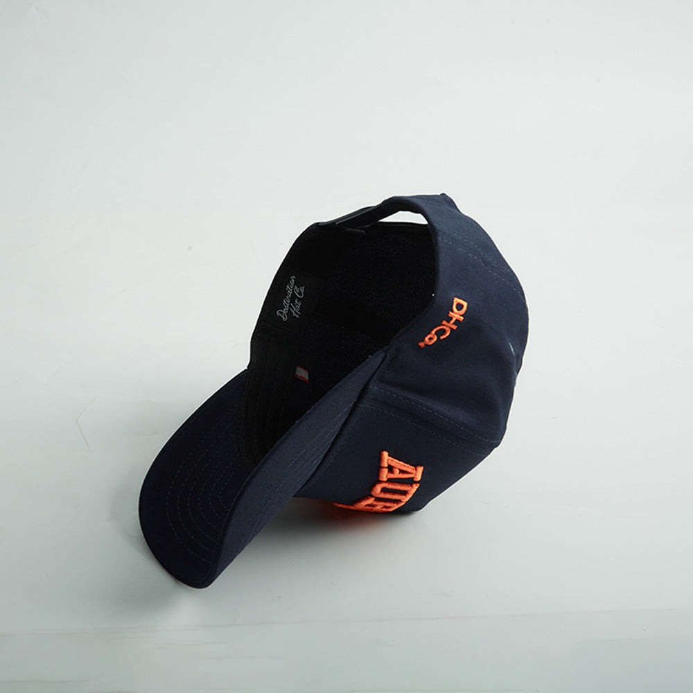 Navy blue cotton snapback hat with bold orange 3D “AUBURN” embroidery and side Alabama State silhouette, part of Auburn Alabama Legacy collection.