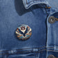 Auburn Eagle Stadium Pin, a round metal button with a glossy finish, Auburn logo, and soaring eagle design