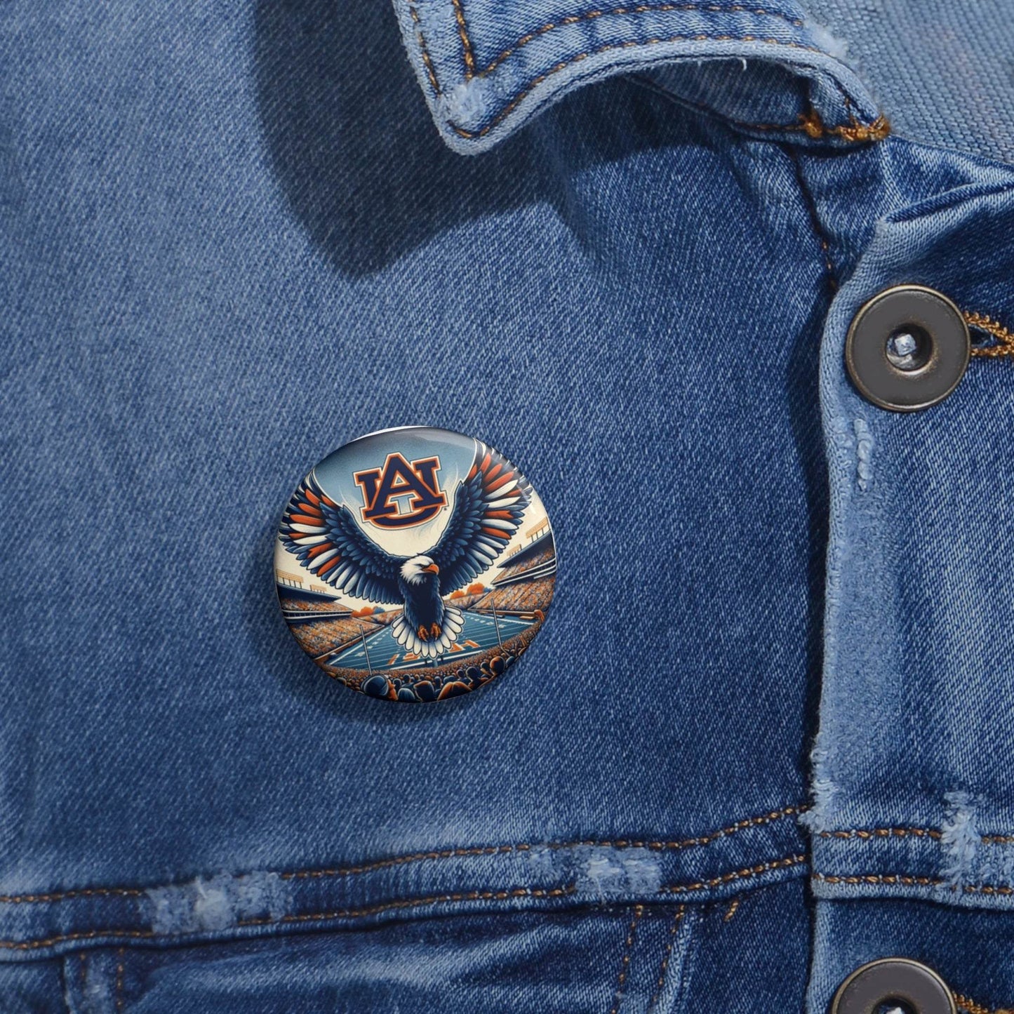 Auburn Eagle Stadium Pin, a round metal button with a glossy finish, Auburn logo, and soaring eagle design