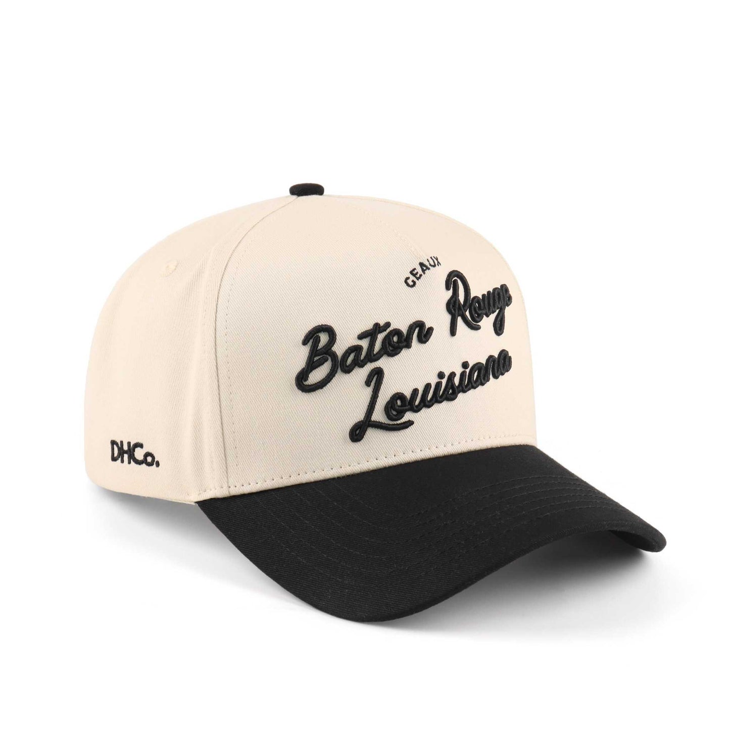 Baton Rouge script trucker hat in beige and black, featuring embroidered lettering and a pre-curved brim