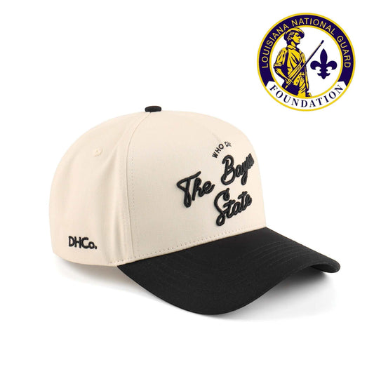 Bayou Script Hat, beige and black cotton trucker cap with embroidered script and pre-curved brim
