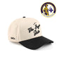 Bayou Script Hat, beige and black cotton trucker cap with embroidered script and pre-curved brim

