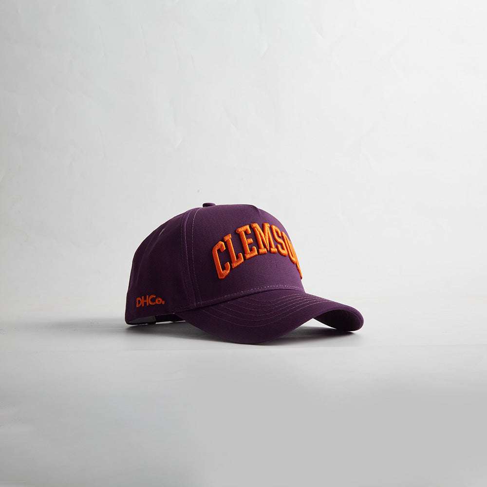 Clemson South Carolina baseball cap in purple fabric with orange 3D Clemson embroidery and curved bill