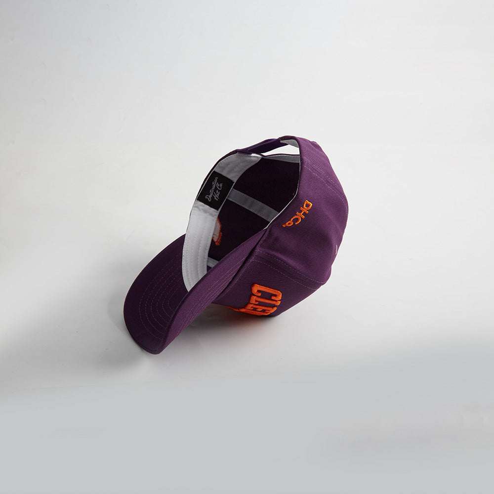 Clemson South Carolina purple baseball cap with orange embroidered lettering, curved brim, and adjustable back