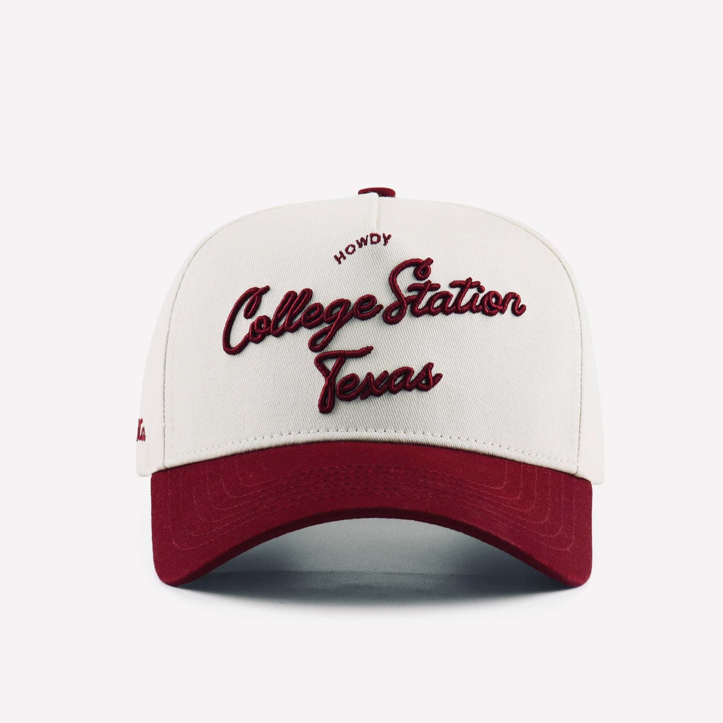 College Station Script Hat in beige with maroon embroidered script and pre-curved maroon brim