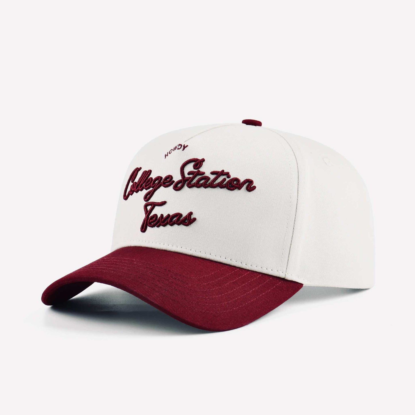 College Station Script Hat in beige and maroon with embroidered script lettering and a pre-curved brim