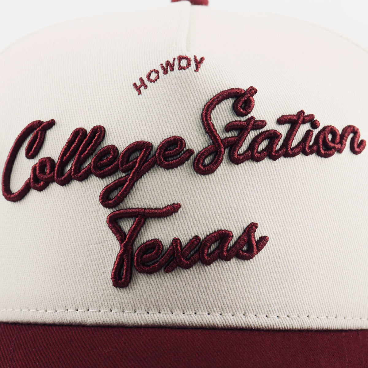 College Station Script Hat with cream fabric and maroon embroidered College Station Texas script