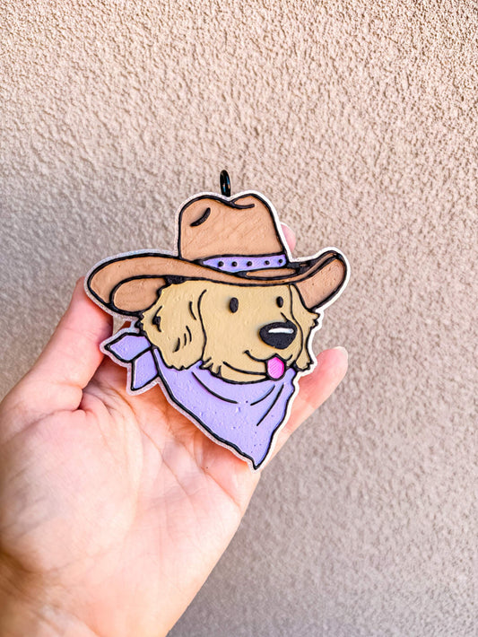 Cowboy Puppy Freshie featuring a tan puppy in a cowboy hat with a purple bandana and collar