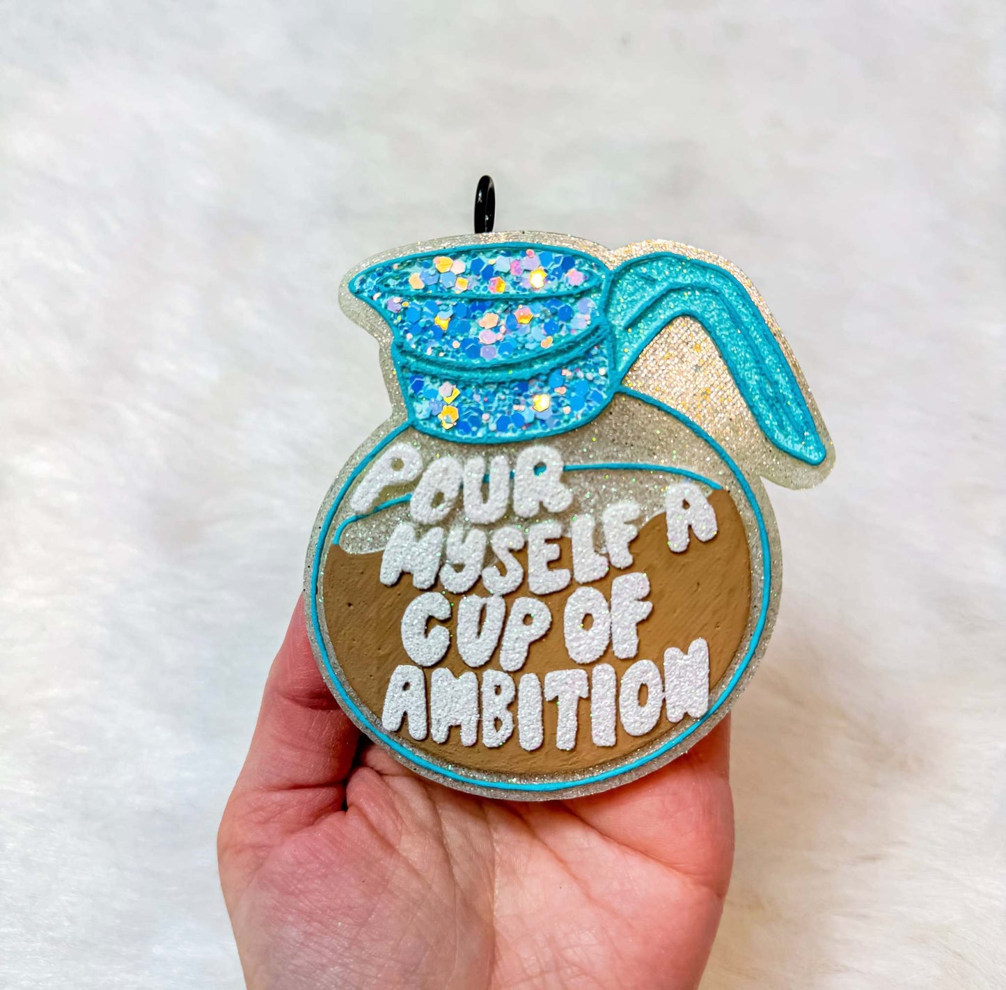 Cup Of Ambition Freshie, glittery brown coffee cup design with turquoise straw, blue floral sprinkles, and raised white lettering