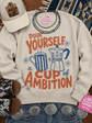 Unisex graphic sweatshirt with Dolly Parton inspired Pour Yourself A Cup of Ambition design