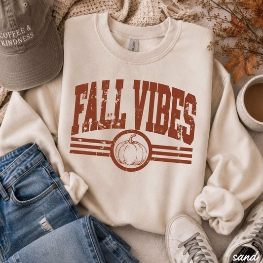 Fall Vibes Sweatshirt in cream cotton blend with distressed rust lettering, stripes, and pumpkin graphic